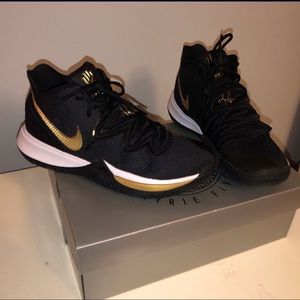 Black metallic gold Kyrie 5’s.